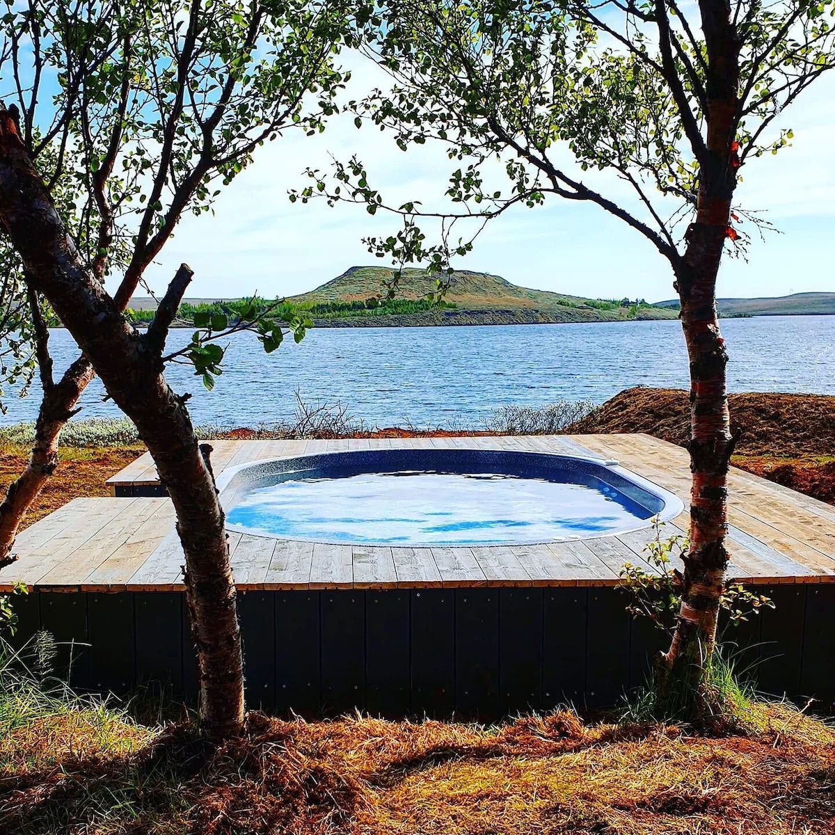 The geothermal hot tub on the deck over the lake