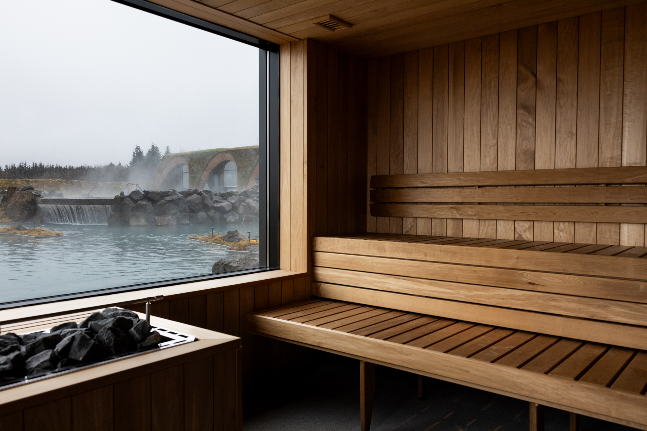 A sauna interior overlooking a lagoon